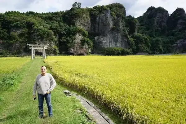 Jason in his first rice-paddy (with the tunnel behind him)
