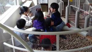 Kids playing on Aso Boy train in Kyushu